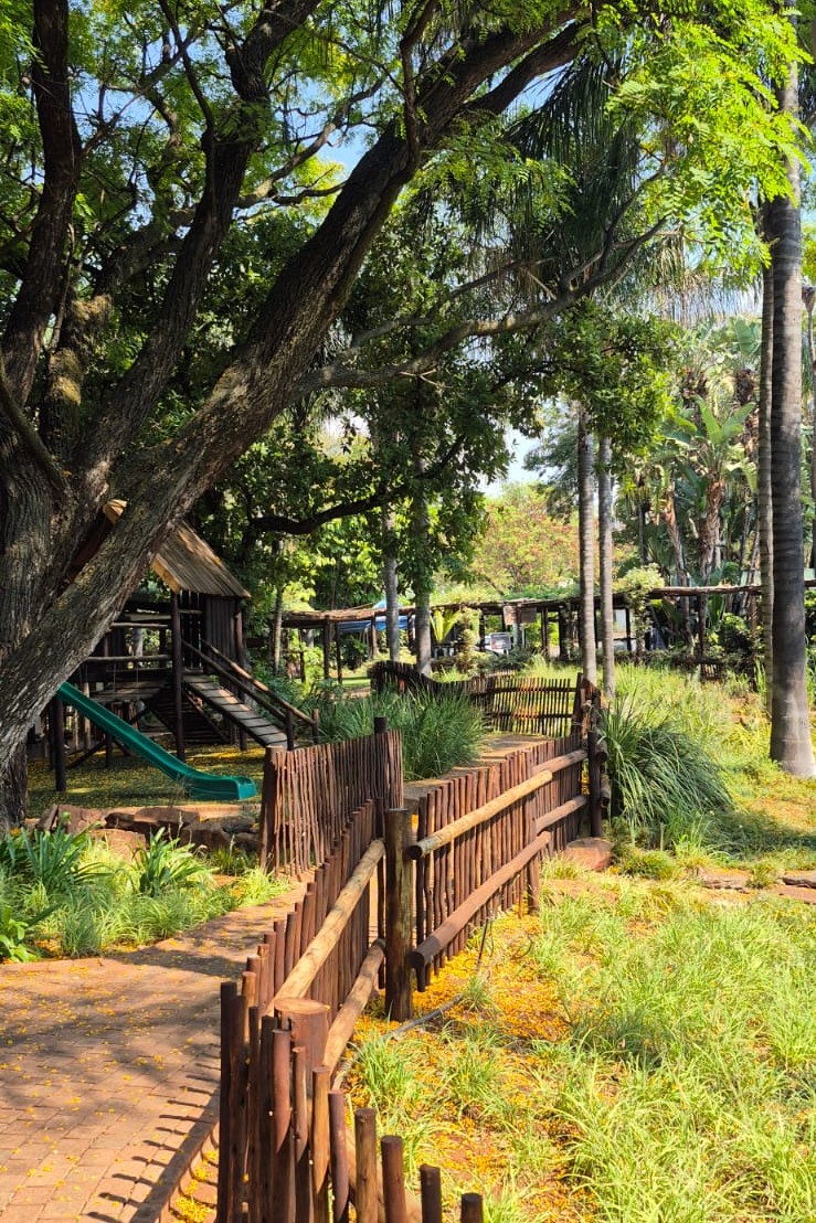 Garden walkway and kids' play area at Toureiro